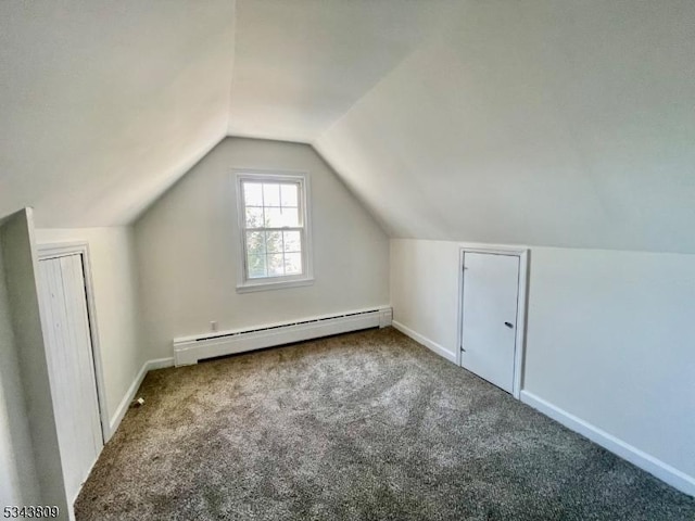 additional living space featuring baseboard heating, baseboards, lofted ceiling, and carpet floors