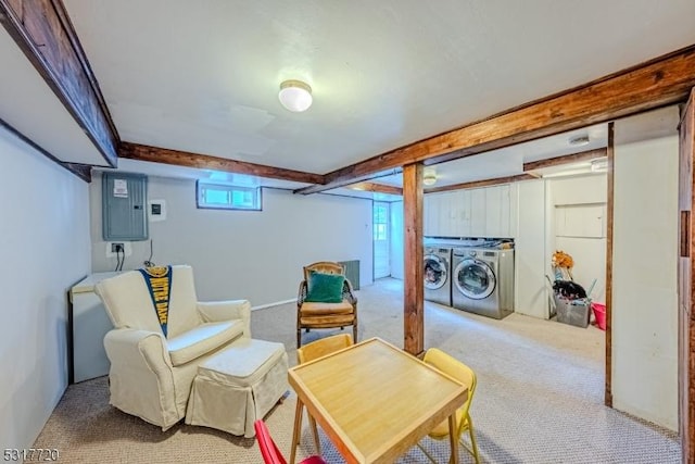 living area featuring electric panel, beam ceiling, carpet, and washer and clothes dryer