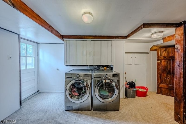 clothes washing area with laundry area, carpet, and separate washer and dryer