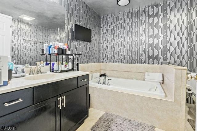 bathroom featuring vanity, a garden tub, tile patterned flooring, and wallpapered walls