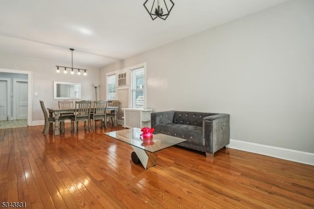 living room with baseboards and hardwood / wood-style flooring