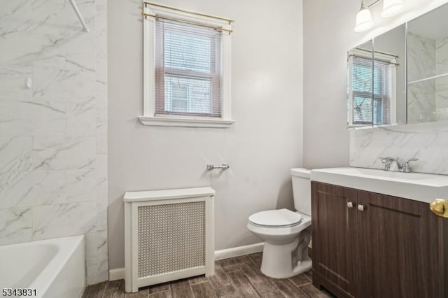 full bath with wood tiled floor, toilet, backsplash, radiator, and vanity