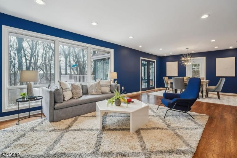 30 Edgemont Rd, West Orange Twp, NJ 07052 - living room featuring a chandelier, recessed lighting, baseboards, and wood finished floors