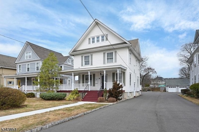 view of front of house with an outdoor structure and covered porch