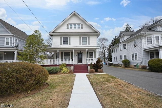 view of front of house featuring a porch and a front yard