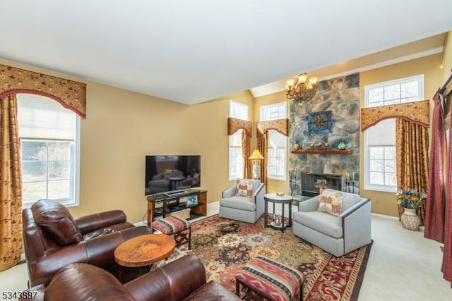 carpeted living room with an inviting chandelier, a fireplace, and vaulted ceiling