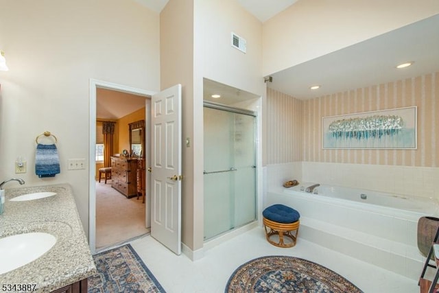 full bathroom featuring visible vents, wallpapered walls, a stall shower, a sink, and a bath