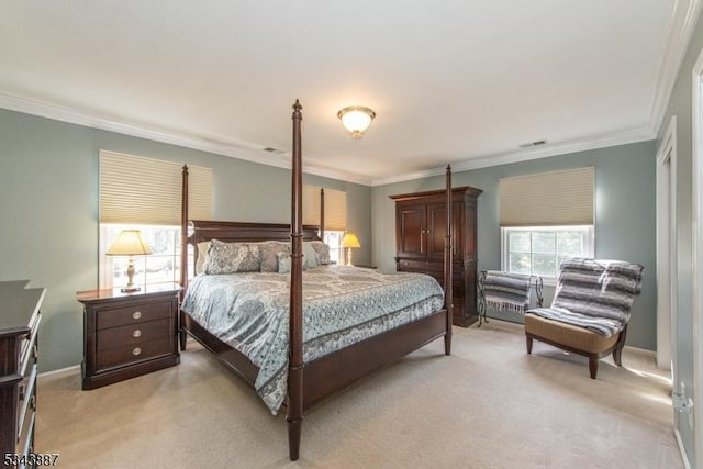 bedroom with light colored carpet and ornamental molding