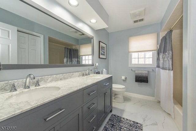 full bathroom featuring marble finish floor, toilet, baseboards, and a sink