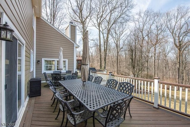 deck featuring outdoor dining area