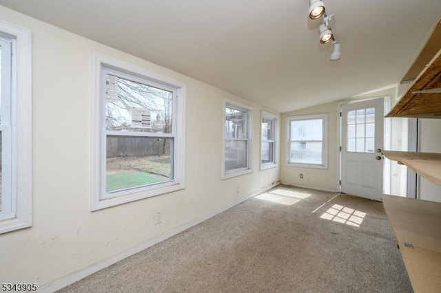 unfurnished sunroom with lofted ceiling