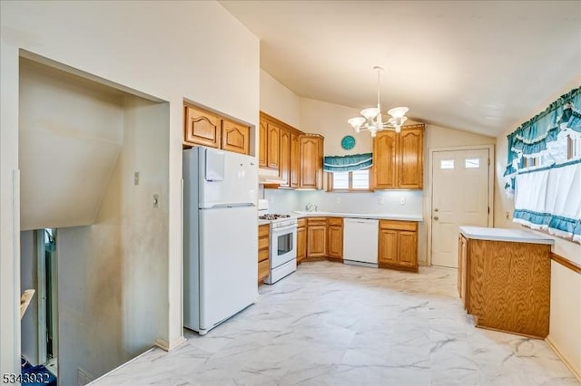 kitchen featuring white appliances, light countertops, vaulted ceiling, marble finish floor, and a chandelier