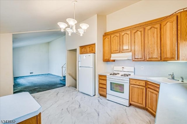 kitchen featuring under cabinet range hood, light countertops, brown cabinets, white appliances, and a sink