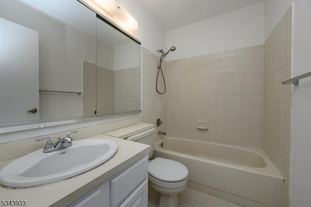 bathroom with toilet, shower / washtub combination, and vanity