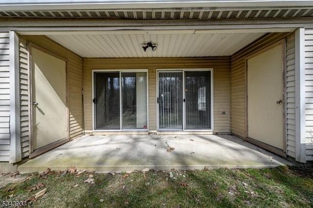 entrance to property featuring a patio