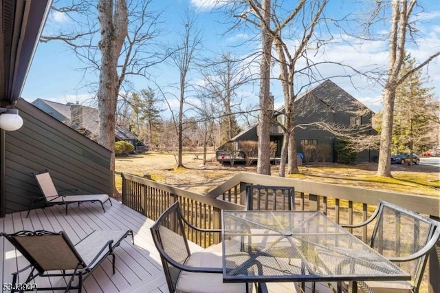 wooden deck with outdoor dining area