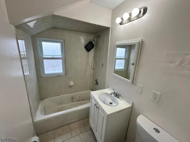 bathroom featuring tile patterned flooring, plenty of natural light, toilet, and vanity