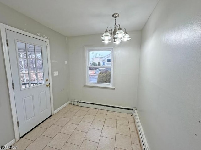 interior space featuring a notable chandelier, a baseboard heating unit, and baseboards