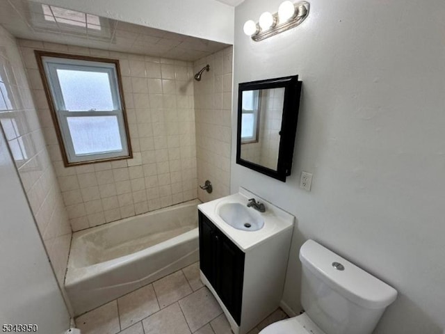 bathroom featuring vanity, toilet,  shower combination, and tile patterned flooring