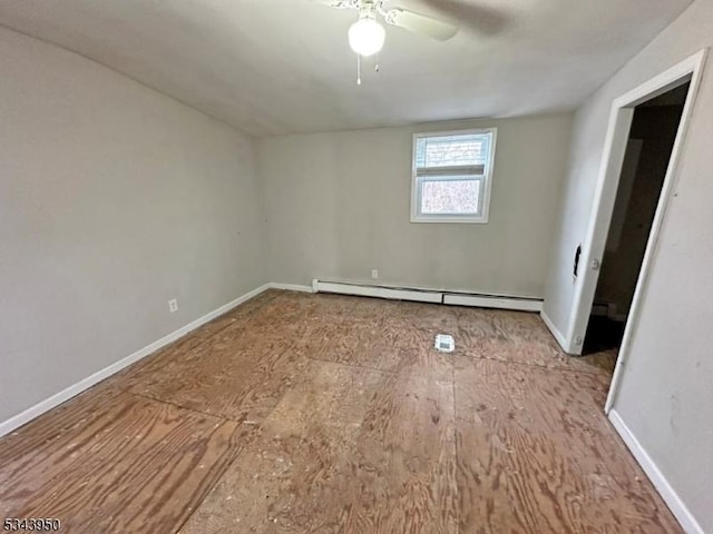 unfurnished bedroom with a baseboard heating unit, baseboards, and ceiling fan