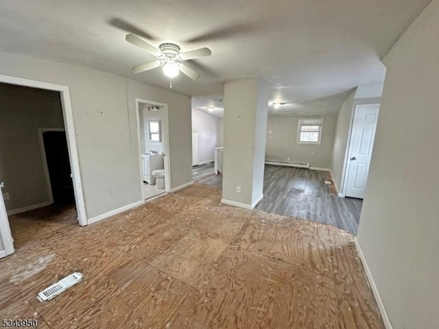 unfurnished living room featuring visible vents, baseboards, a ceiling fan, and a baseboard radiator