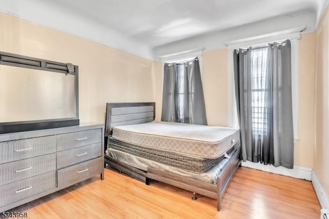 bedroom with wood finished floors