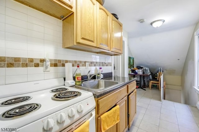 kitchen featuring white range with electric cooktop, vaulted ceiling, light tile patterned floors, decorative backsplash, and a sink