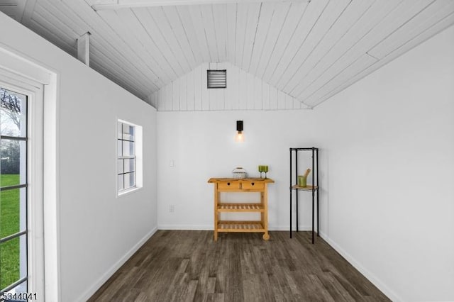 empty room featuring wood ceiling, a healthy amount of sunlight, wood finished floors, and vaulted ceiling