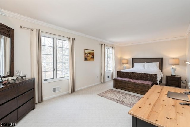 bedroom featuring crown molding, baseboards, visible vents, and light carpet