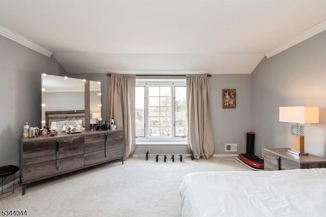 carpeted bedroom with vaulted ceiling, baseboards, visible vents, and ornamental molding