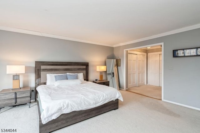 bedroom featuring crown molding, light colored carpet, baseboards, and a closet