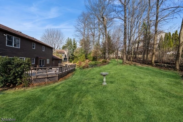 view of yard featuring a deck