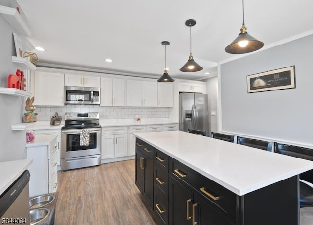 kitchen with open shelves, appliances with stainless steel finishes, white cabinets, light countertops, and dark cabinets