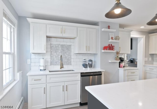 kitchen featuring open shelves, dishwasher, light countertops, white cabinetry, and a sink