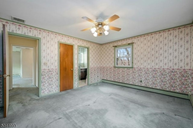 carpeted empty room featuring wallpapered walls, visible vents, baseboard heating, and ceiling fan