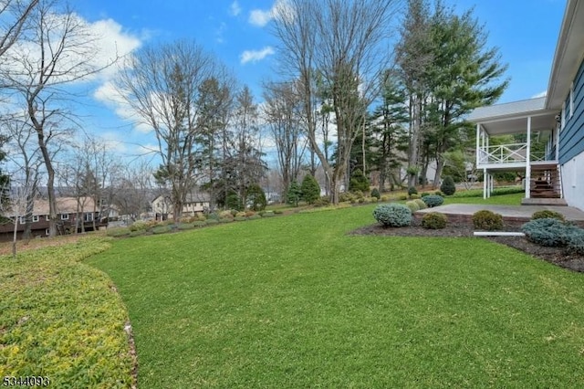 view of yard featuring stairs