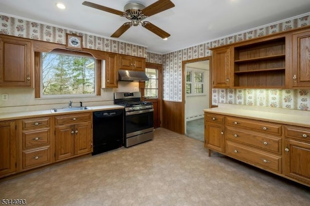 kitchen featuring under cabinet range hood, a sink, black dishwasher, gas stove, and wallpapered walls