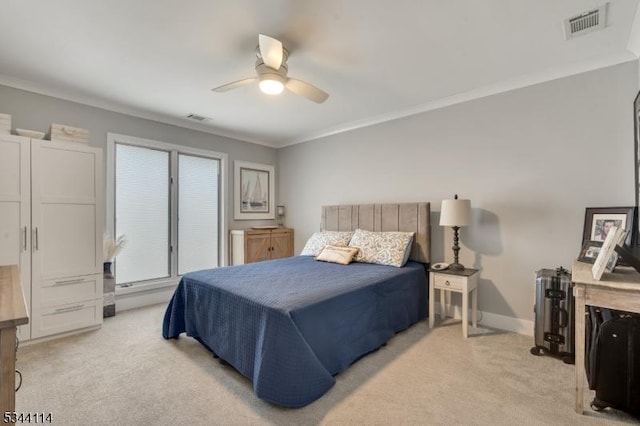 bedroom with visible vents, light carpet, and ornamental molding