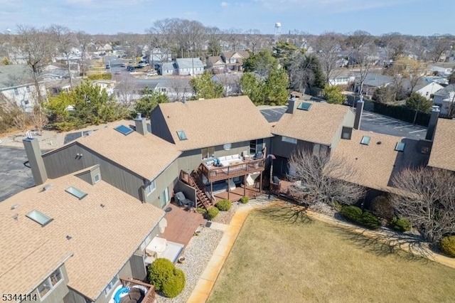 birds eye view of property with a residential view