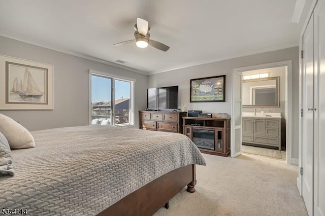 bedroom with a ceiling fan, visible vents, ensuite bath, ornamental molding, and light colored carpet