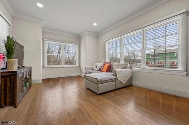 sitting room featuring recessed lighting, baseboards, wood finished floors, and crown molding