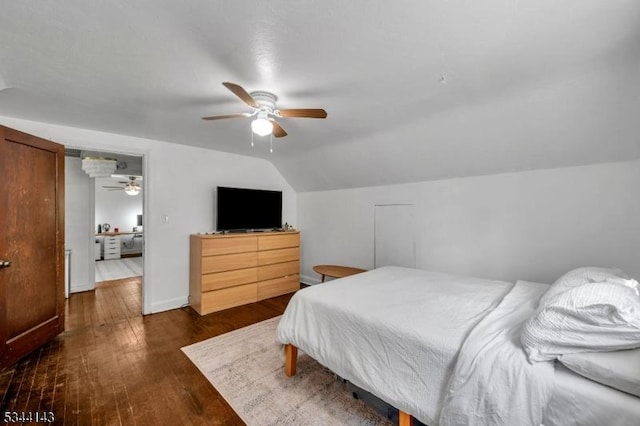 bedroom featuring baseboards, ceiling fan, lofted ceiling, and dark wood-type flooring