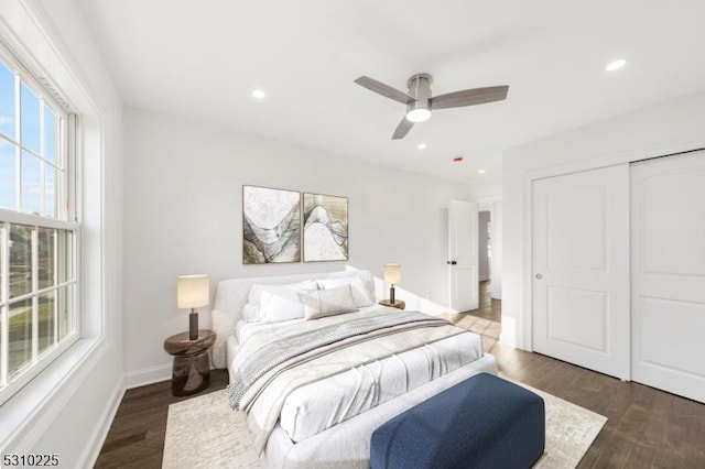 bedroom featuring recessed lighting, a closet, baseboards, and wood finished floors