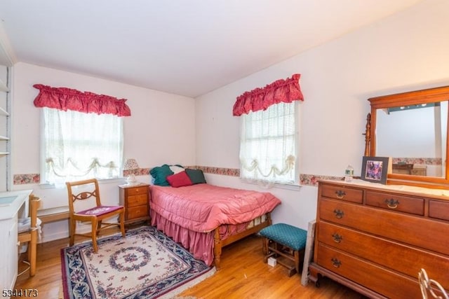 bedroom featuring light wood-style flooring