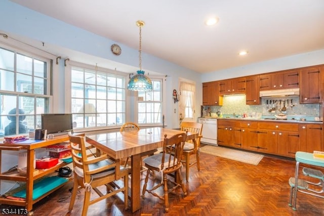 dining space featuring recessed lighting