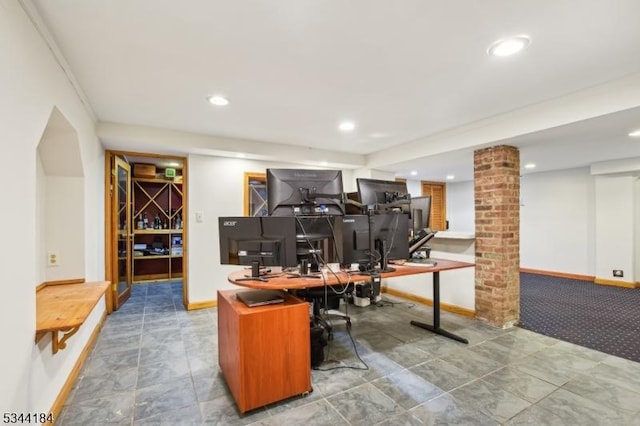 office space with decorative columns, recessed lighting, and baseboards