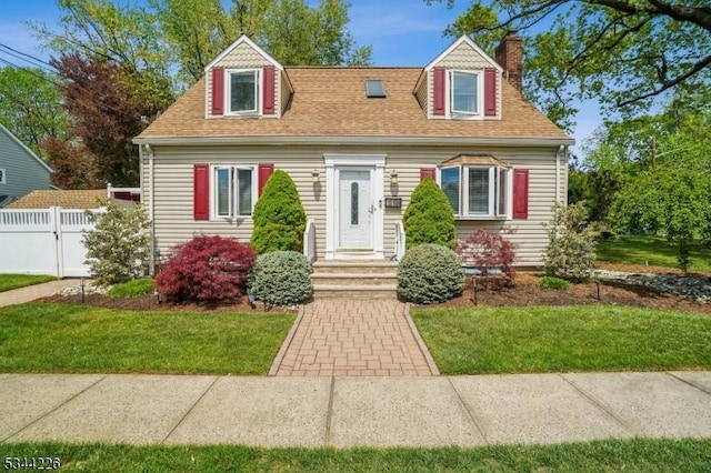 118 Indian Run Pkwy, Union Twp, NJ 07083 - cape cod-style house with fence, roof with shingles, a chimney, and a front lawn