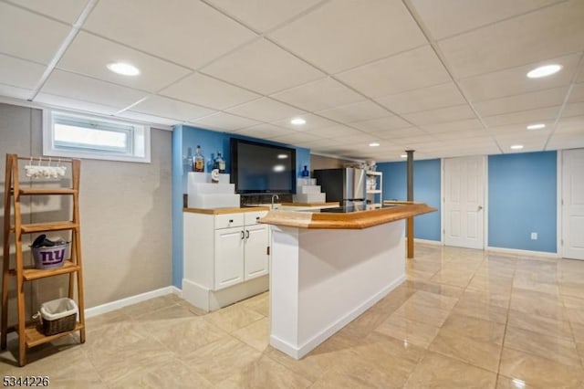 118 Indian Run Pkwy, Union Twp, NJ 07083 - kitchen with freestanding refrigerator, baseboards, recessed lighting, a paneled ceiling, and white cabinets