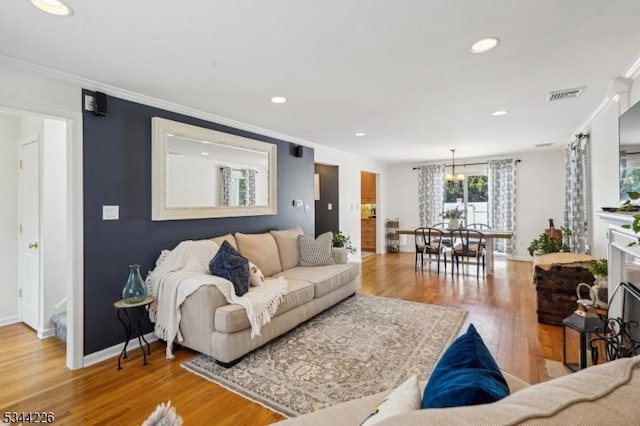 118 Indian Run Pkwy, Union Twp, NJ 07083 - living area with crown molding, baseboards, visible vents, and wood finished floors