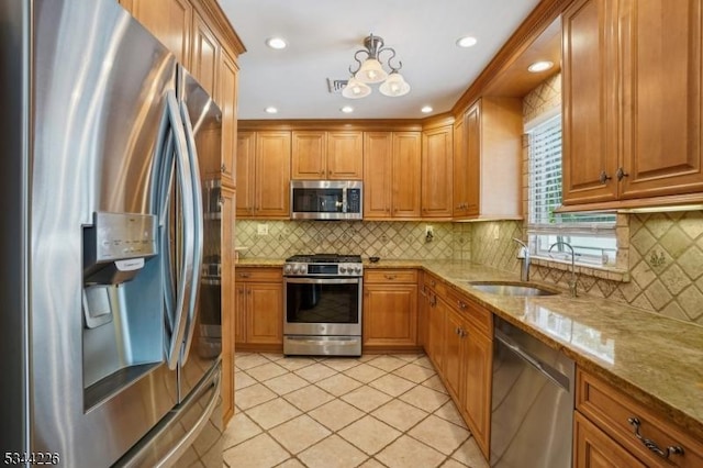 118 Indian Run Pkwy, Union Twp, NJ 07083 - kitchen with backsplash, light stone countertops, appliances with stainless steel finishes, and light tile patterned floors